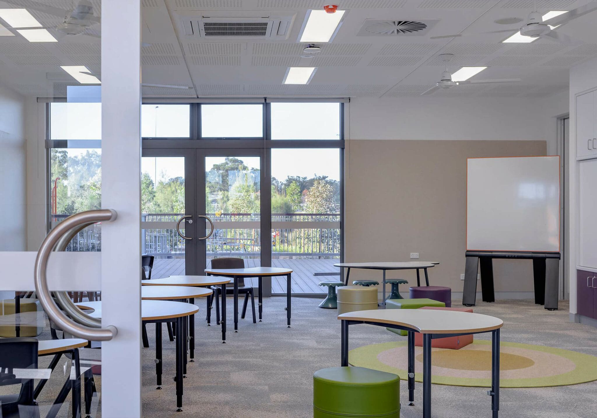white classroom with stools