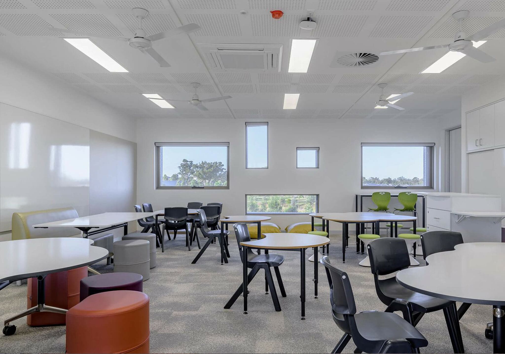 white classroom with black chairs