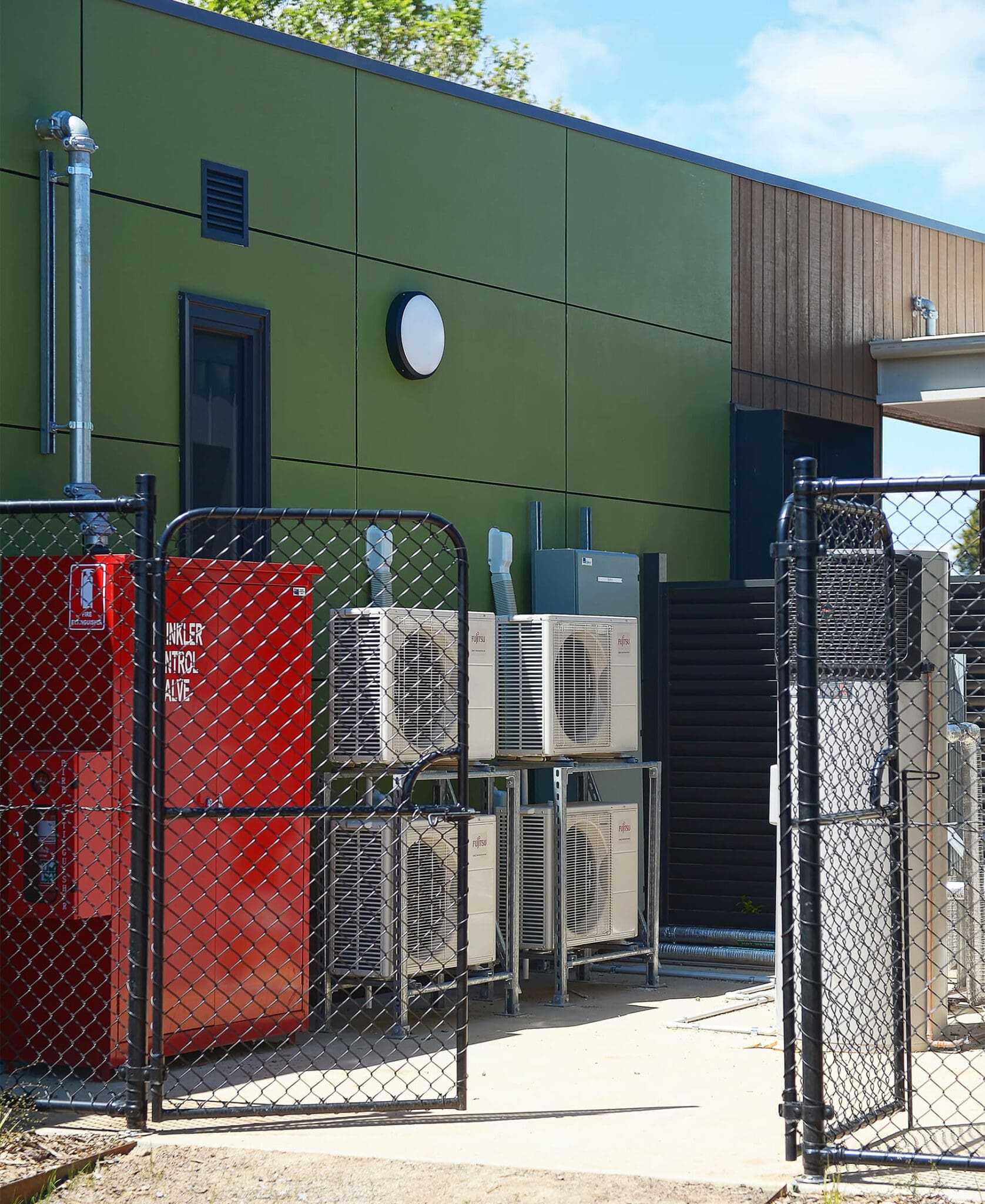 a group of air conditioning units outside of a building