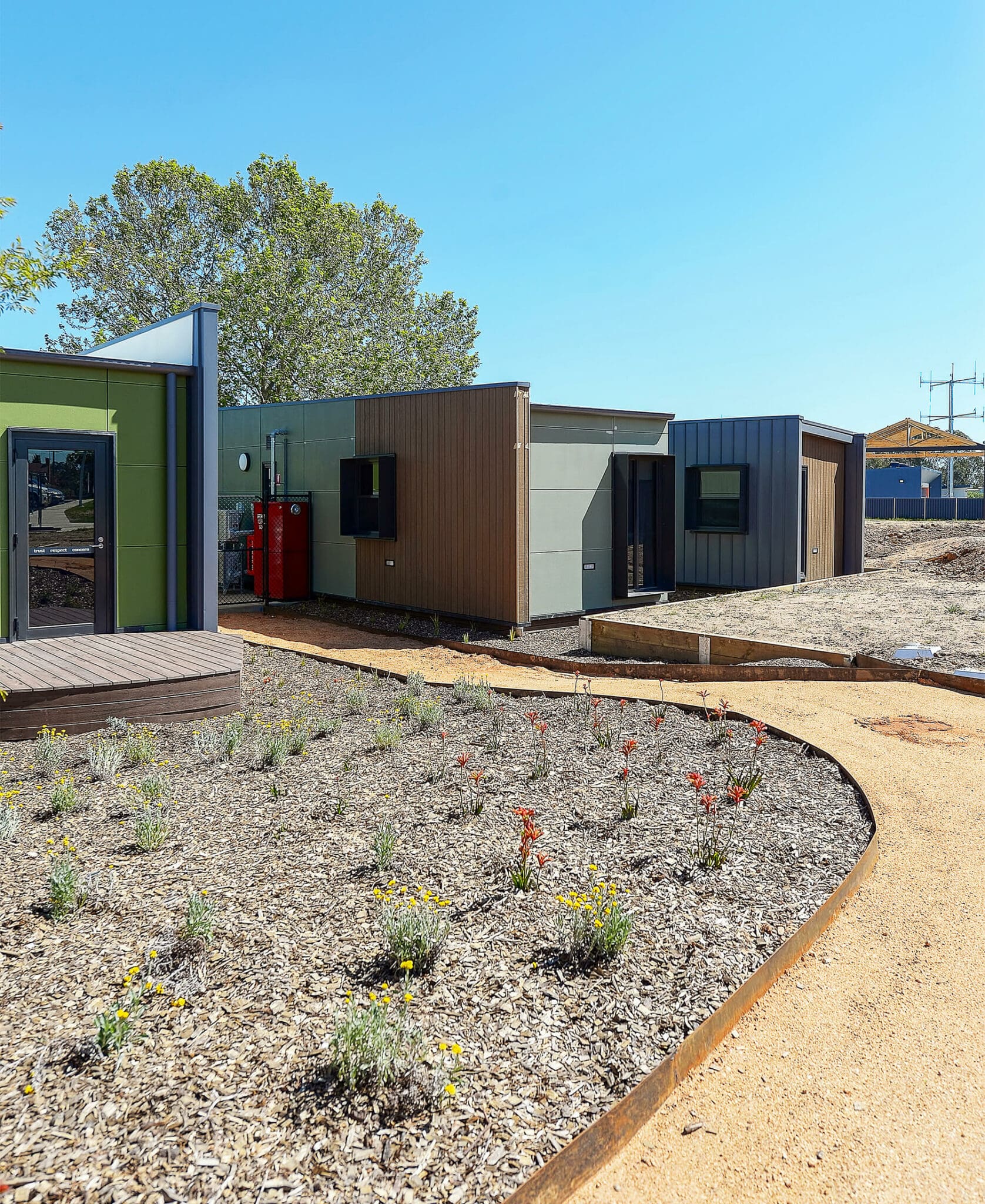 a small building with a gravel path
